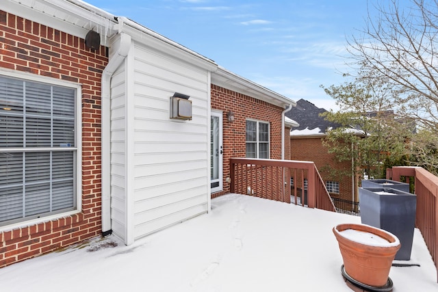 view of snow covered deck