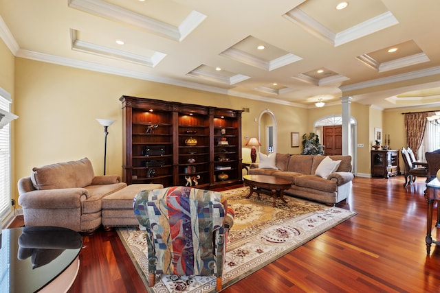 living room with dark wood-type flooring, arched walkways, crown molding, and ornate columns