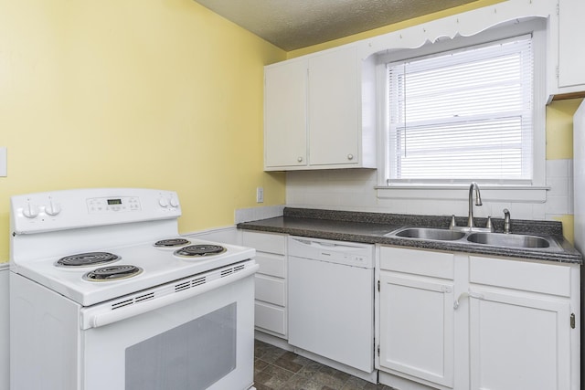 kitchen featuring white cabinetry, white appliances, sink, and a textured ceiling