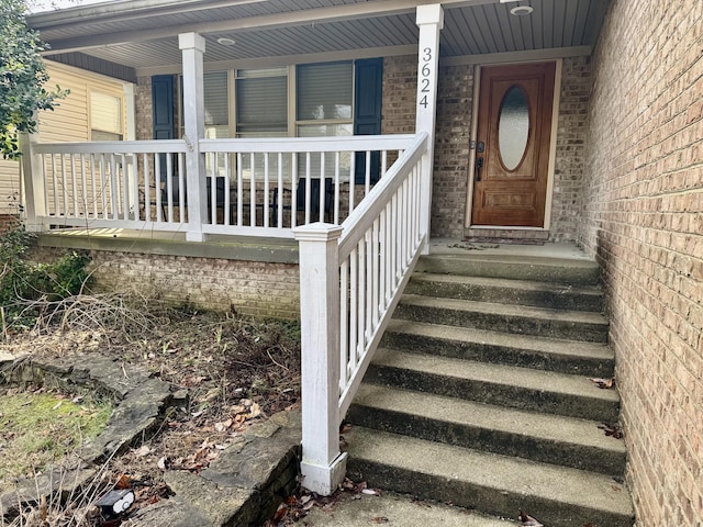 property entrance with covered porch