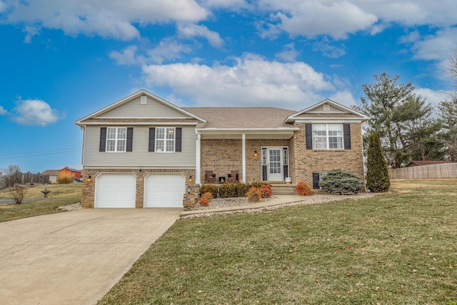 view of front of home with a garage and a front lawn