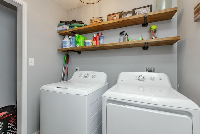 washroom featuring washer and dryer