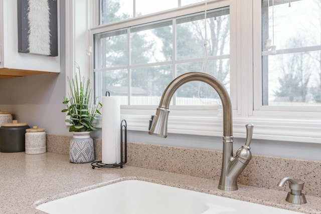 interior details with sink and light stone counters