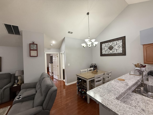 403 Chateau Pl, Bronston, KY 42518 - kitchen featuring sink, an inviting chandelier, high vaulted ceiling, dark hardwood / wood-style floors, and decorative light fixtures