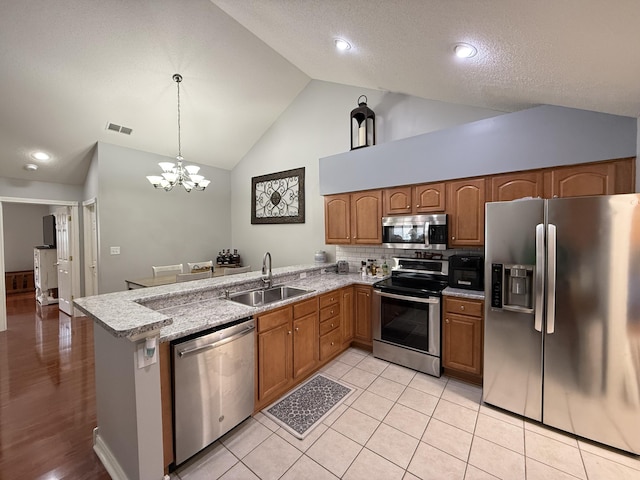 403 Chateau Pl, Bronston, KY 42518 - kitchen with appliances with stainless steel finishes, decorative light fixtures, sink, decorative backsplash, and kitchen peninsula