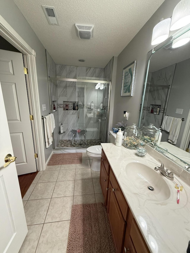 403 Chateau Pl, Bronston, KY 42518 - bathroom with toilet, an enclosed shower, a textured ceiling, vanity, and tile patterned flooring