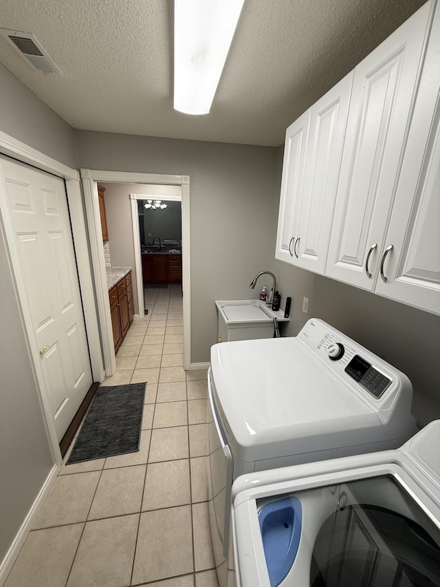 403 Chateau Pl, Bronston, KY 42518 - clothes washing area with cabinets, sink, light tile patterned floors, and independent washer and dryer