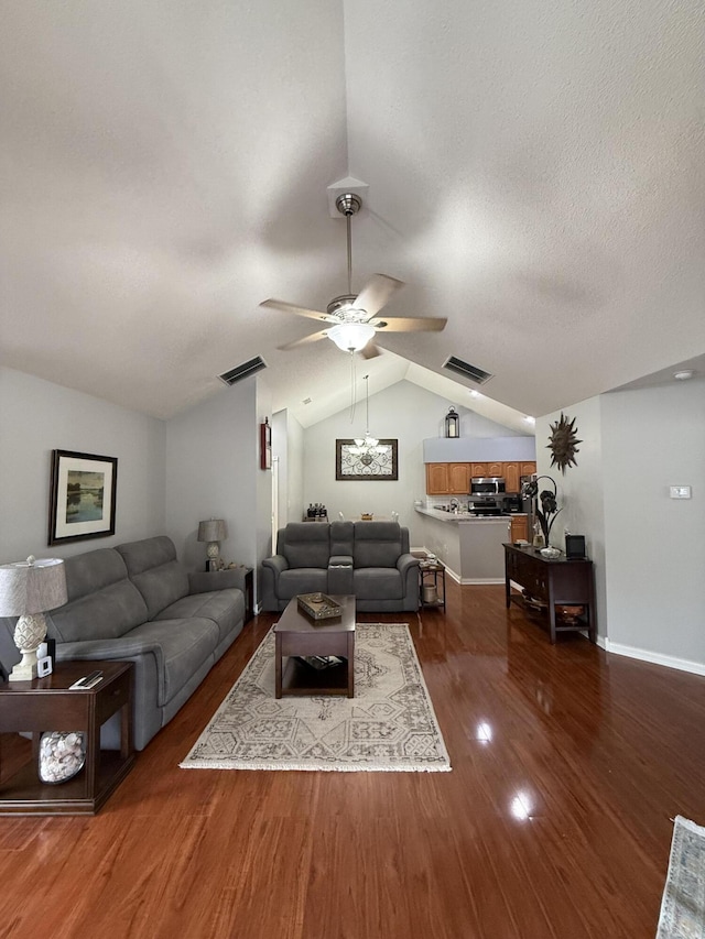 403 Chateau Pl, Bronston, KY 42518 - living room with ceiling fan, dark hardwood / wood-style floors, vaulted ceiling, and a textured ceiling