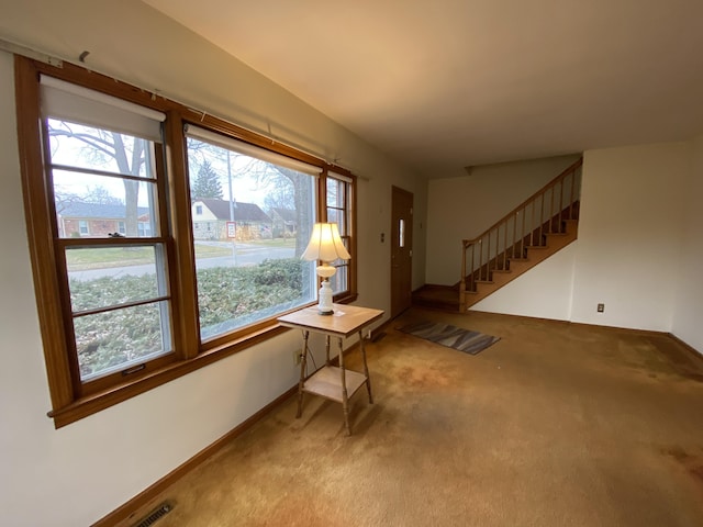 interior space featuring light colored carpet