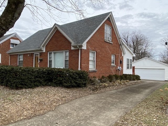 view of front facade featuring an outbuilding and a garage