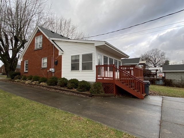 view of home's exterior featuring a lawn