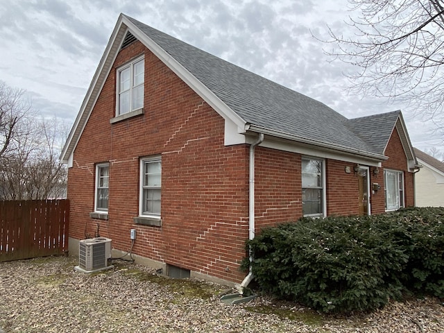 view of side of home featuring central AC unit