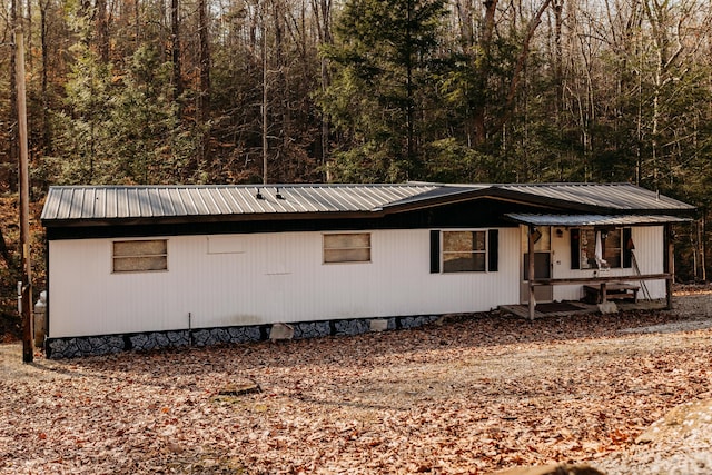 view of side of property featuring a porch