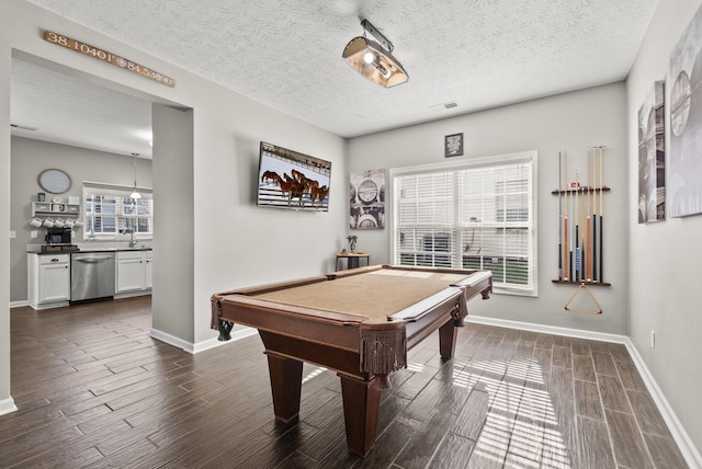 game room featuring plenty of natural light, sink, a textured ceiling, and billiards