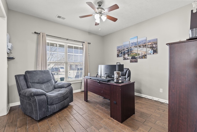 office area featuring ceiling fan, a textured ceiling, and dark hardwood / wood-style flooring