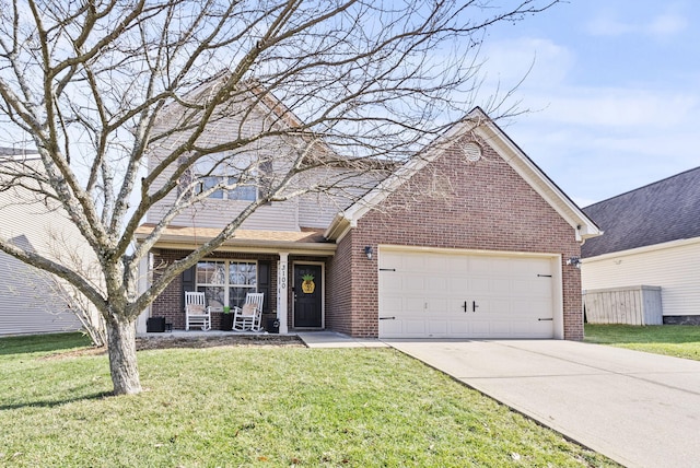 view of front property with a garage, covered porch, and a front lawn