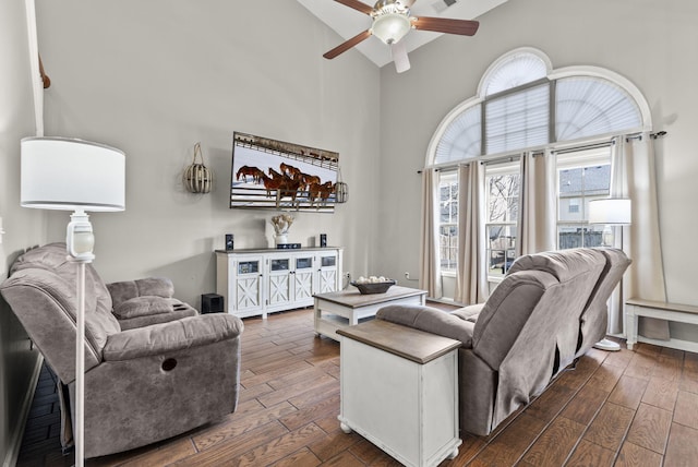 living room featuring high vaulted ceiling and ceiling fan