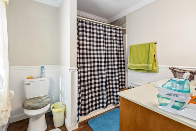 bathroom featuring toilet, a shower with curtain, wood-type flooring, ornamental molding, and vanity