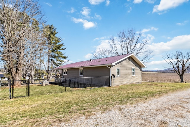 view of property exterior with a yard