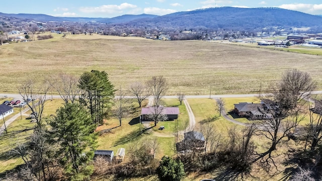 drone / aerial view featuring a rural view and a mountain view