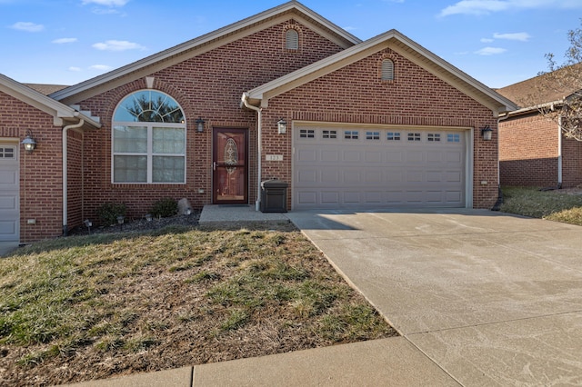 view of front of house featuring a garage and a front lawn