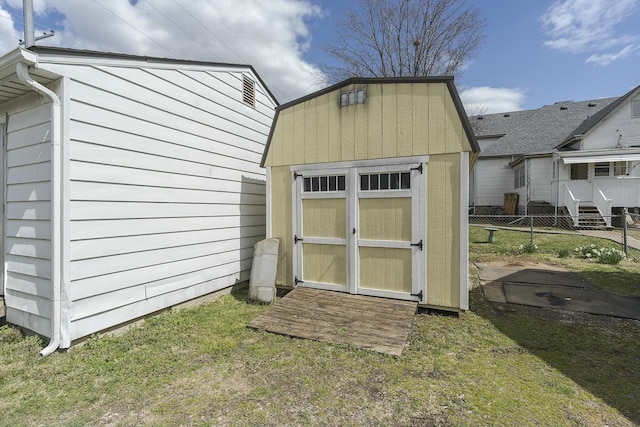 view of shed with fence