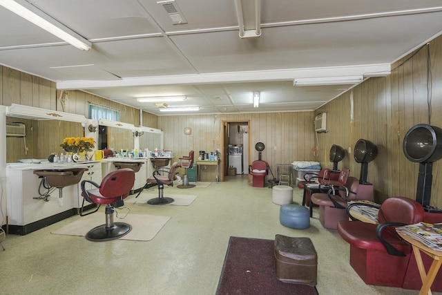 miscellaneous room with visible vents, tile patterned floors, an AC wall unit, and wooden walls