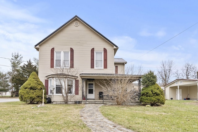 front facade featuring covered porch and a front lawn