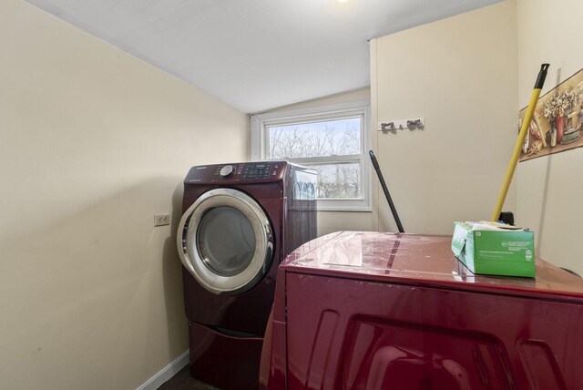 clothes washing area featuring washing machine and clothes dryer