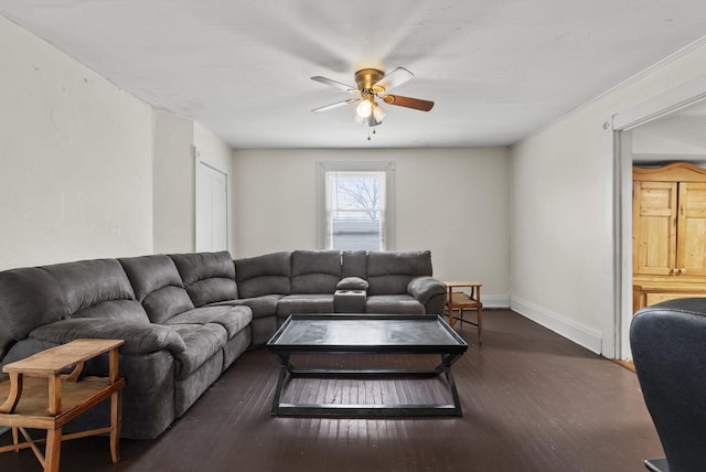 living room featuring dark hardwood / wood-style flooring and ceiling fan