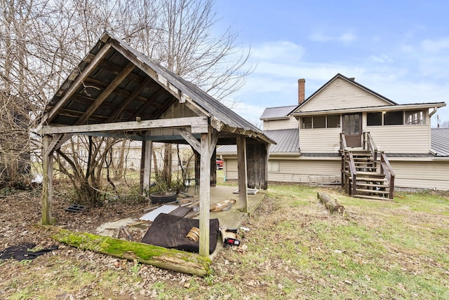 view of yard with a sunroom