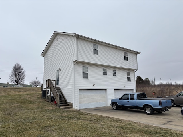 view of property exterior featuring a garage and a yard