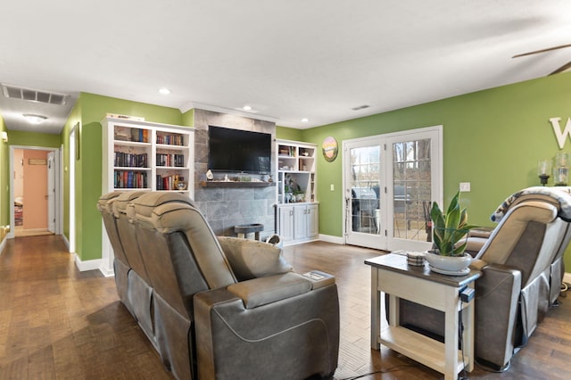 living room with a fireplace and dark hardwood / wood-style flooring