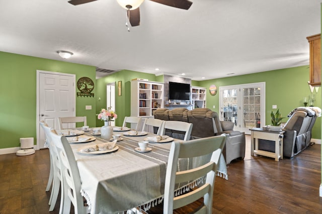 dining space featuring dark hardwood / wood-style floors and ceiling fan