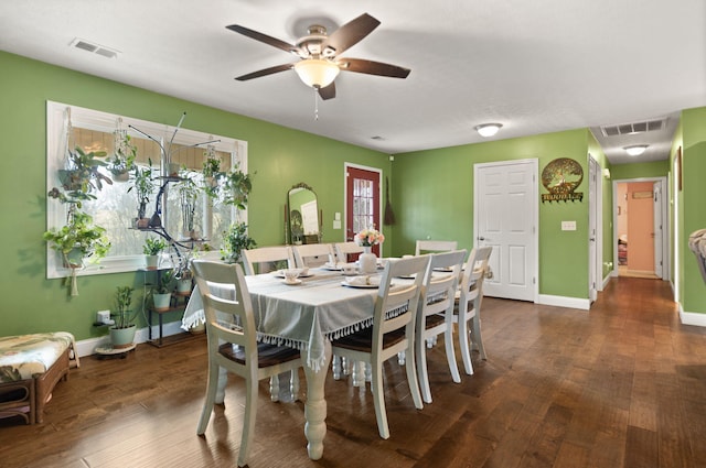 dining space featuring ceiling fan and dark hardwood / wood-style flooring