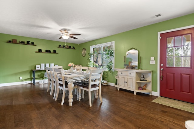 dining space featuring dark hardwood / wood-style floors and ceiling fan