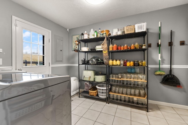 pantry featuring washing machine and dryer and electric panel