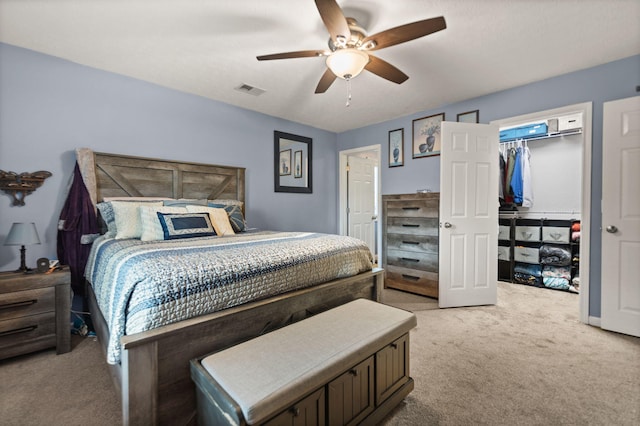 bedroom with ceiling fan and light colored carpet