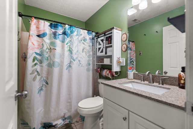 bathroom with toilet, a textured ceiling, vanity, curtained shower, and tile patterned flooring