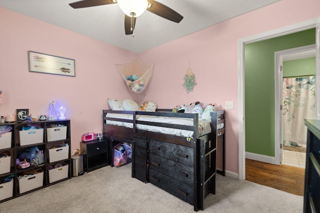 carpeted bedroom with ceiling fan