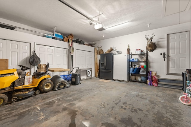 garage with a garage door opener, white fridge, and black fridge with ice dispenser