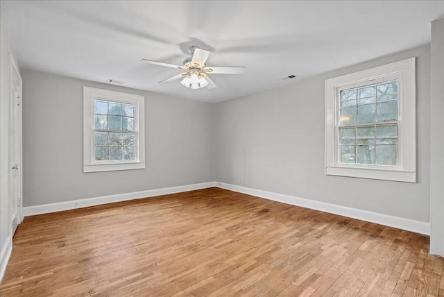 spare room with ceiling fan and light hardwood / wood-style flooring