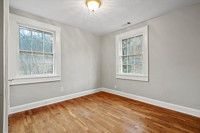 spare room with light wood-type flooring