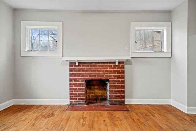 unfurnished living room with hardwood / wood-style floors and a fireplace