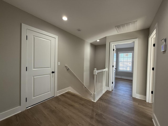 corridor featuring dark hardwood / wood-style flooring