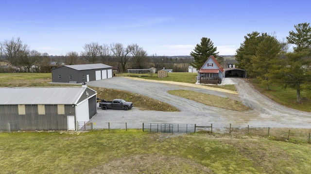 view of yard featuring a garage and an outdoor structure