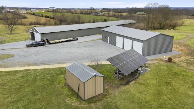 birds eye view of property featuring a rural view