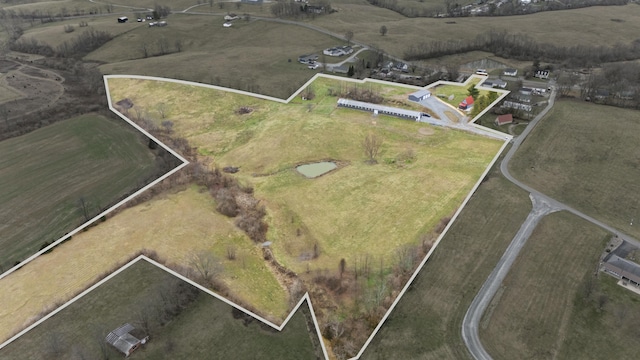 birds eye view of property featuring a rural view