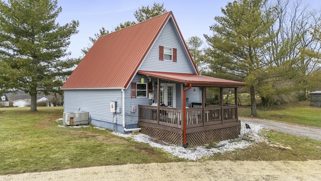 back of house featuring a yard, central AC, and a deck