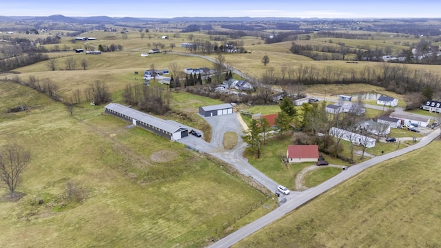 birds eye view of property with a rural view